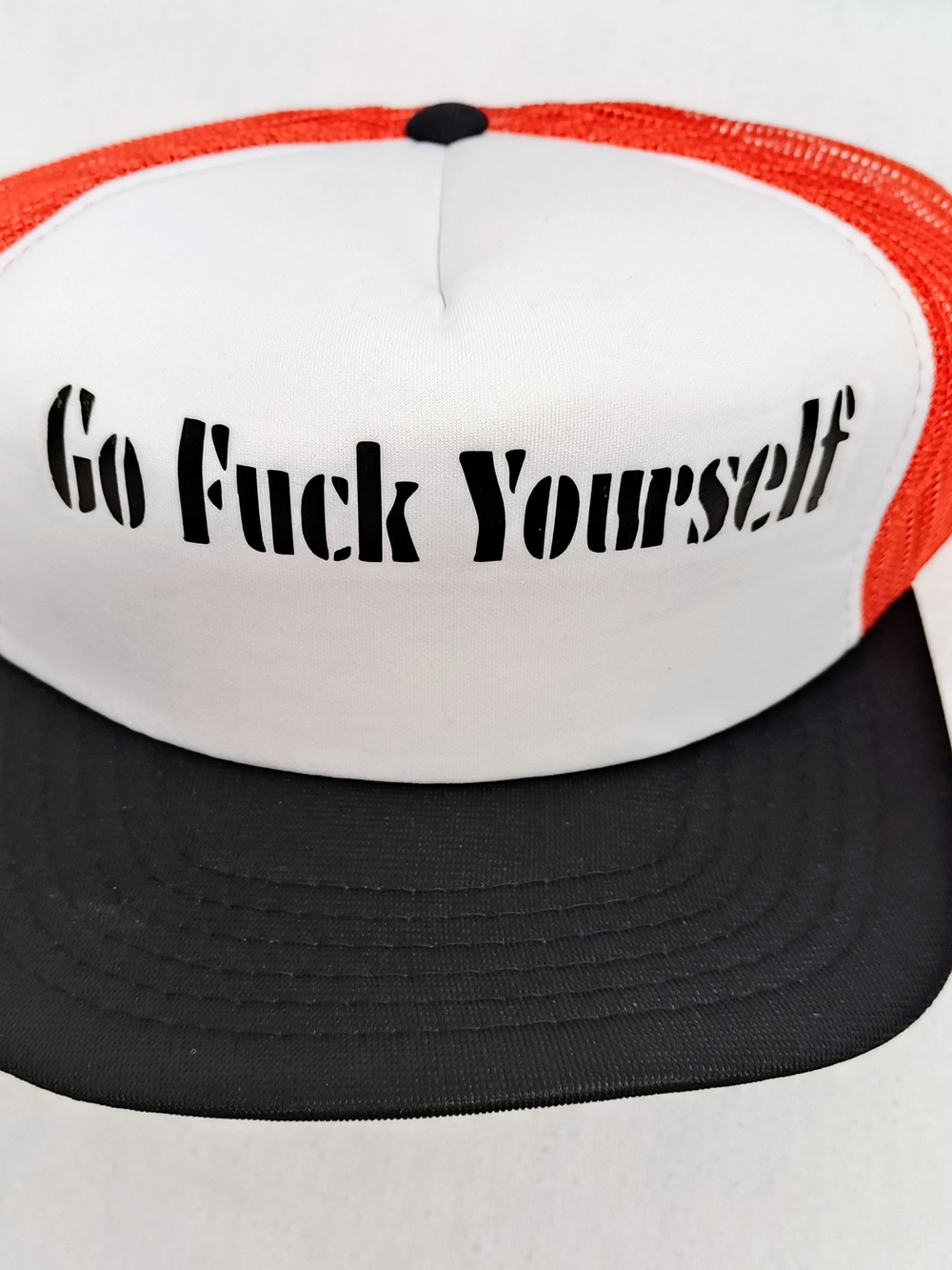 Orange + Black + White  Graphic Trucker Hat w Black Text On Front & Underbrim